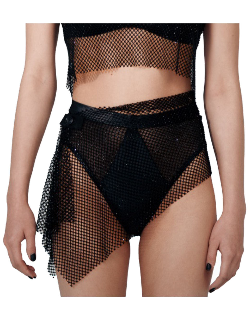 Woman wearing black embellished bottom with mesh overlay